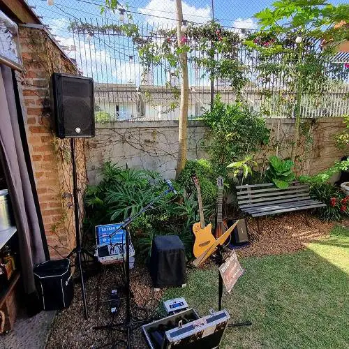 Bose S1 Pro in the lawn with other equipment for karaoke party