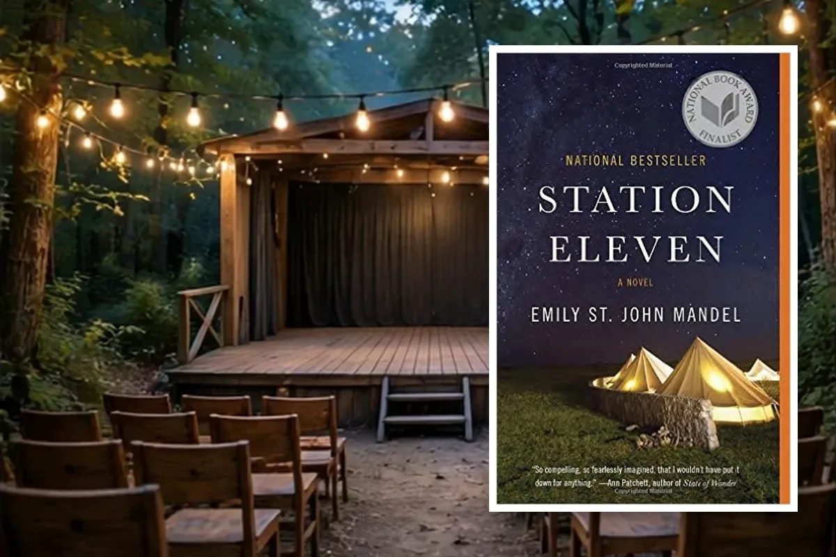 Station Eleven book cover by Emily St. John Mandel placed in an outdoor theatre scene